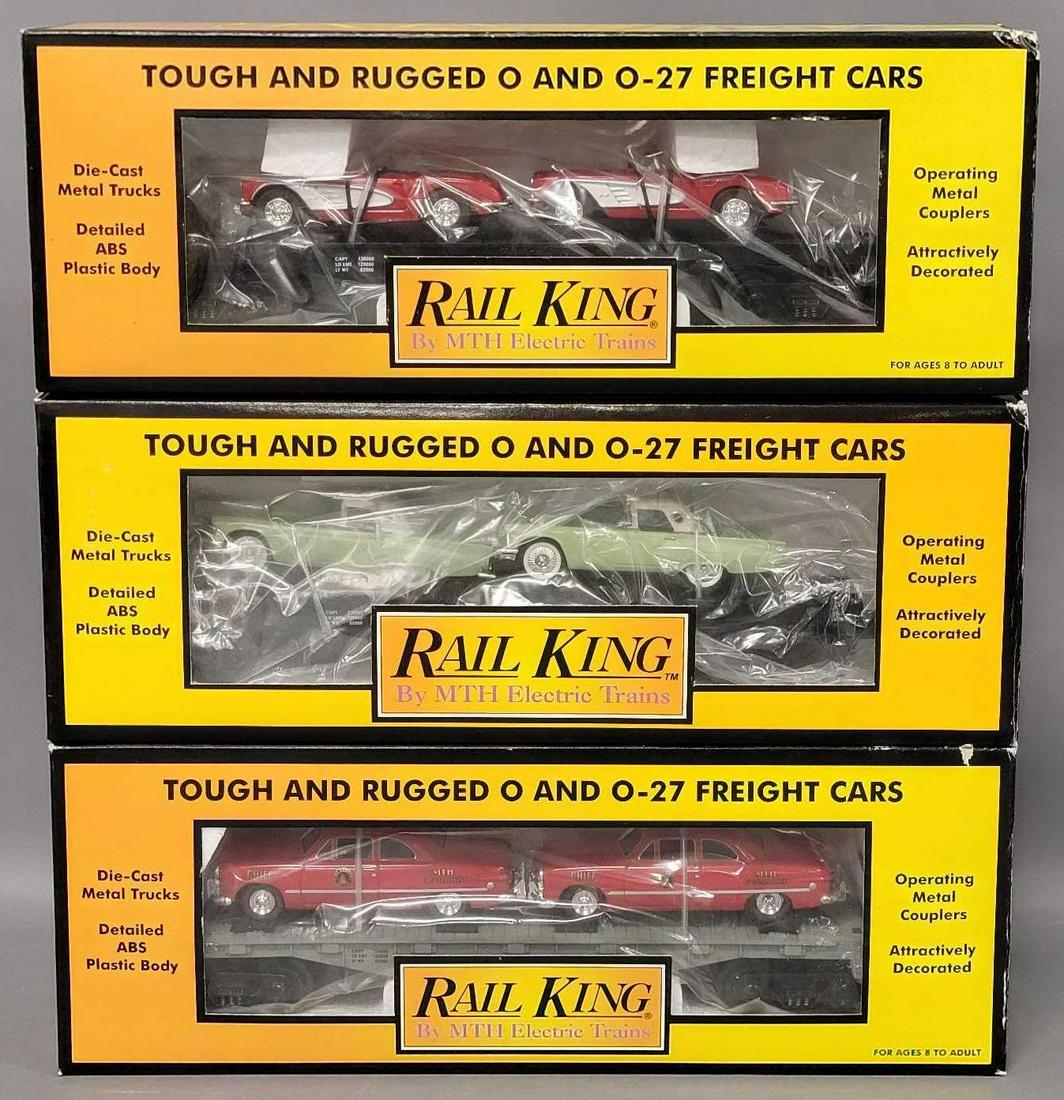 Three Rail King O Gauge MTH Auto transport flat car with ERTL cars in original boxes: Three Rail King O Gauge MTH Auto transport flat car with ERTL cars in original boxes, includes 7613 with Tbirds, 7624 with 1964 Corvettes and 7623 with Fire cars, all appear C7-8 with little to no run