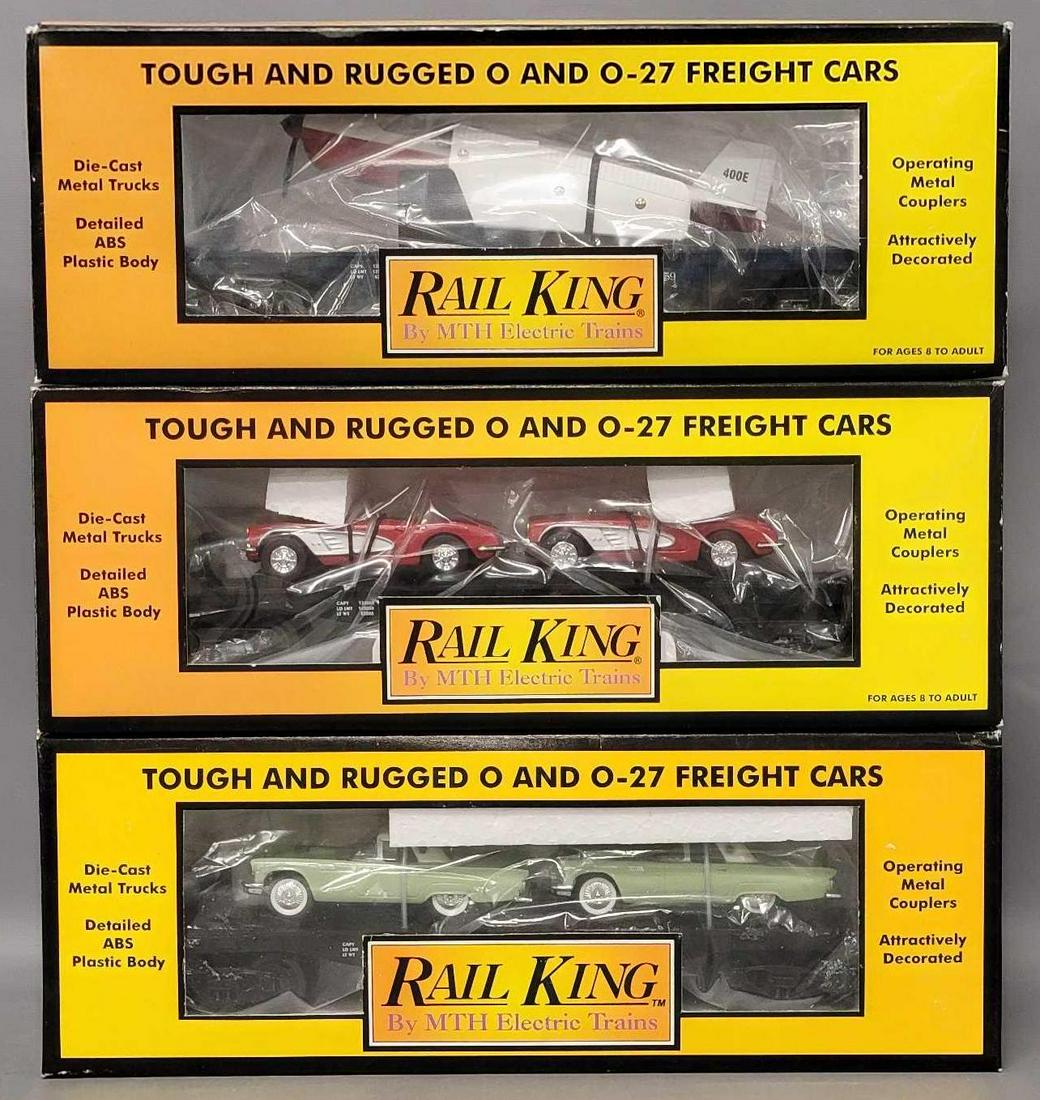 Three Rail King O Gauge MTH Auto transport flat car with ERTL cars in original boxes: Three Rail King O Gauge MTH Auto transport flat car with ERTL cars in original boxes, includes 7613 with Tbirds, 7624 with 1964 Corvettes and 7621 with Airplane, all appear C7-8 with little to no run 