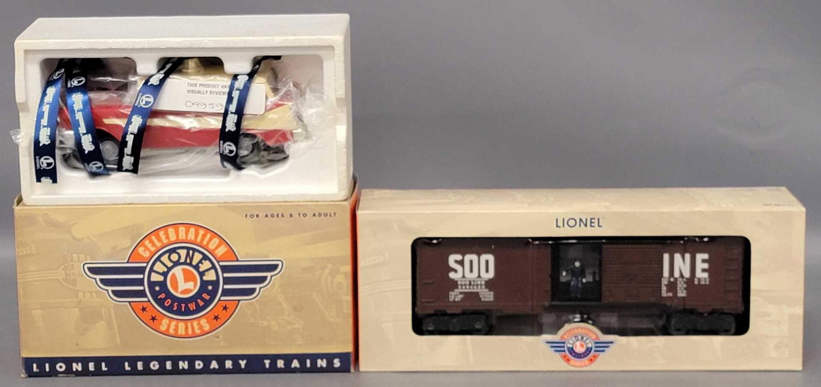 Two Lionel O Gauge Celebration Series train pieces in original boxes: Two Lionel O Gauge Celebration Series train pieces in original boxes, includes 29888 Soo Line Operating box car and 18447 Executive Inspection car, both appear unrun C8-9 in original packaging and ver