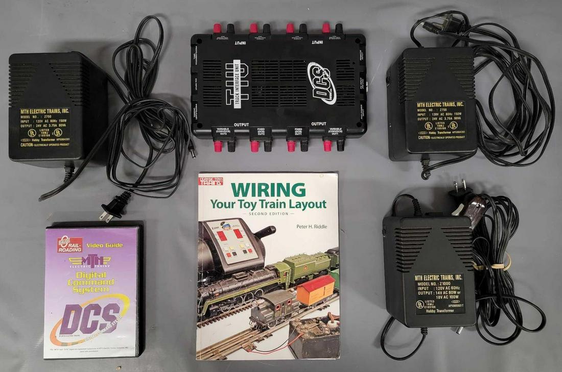 MTH 50-1003 O DCS Track Interface Unit (Older Version) plus three Z750 power packs: MTH 50-1003 O DCS Track Interface Unit (Older Version) plus three Z750 power packs, all untested, selling as is as seen, also including a Book entitled Wiring your toy train layout by Peter H Riddle a