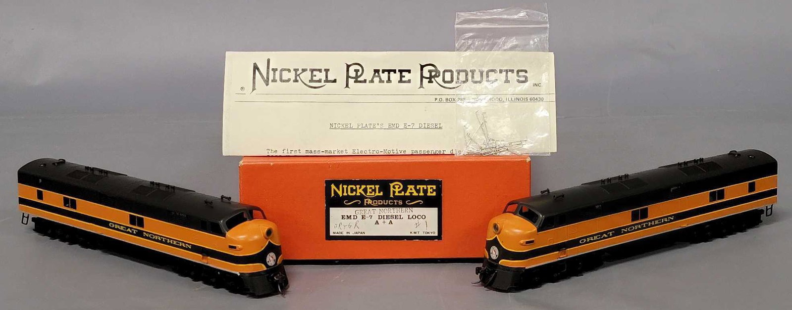 Nickel Plate KMT brass HO Brass GN EMD E7 A + A diesel locomotive in original box: Nickel Plate KMT brass HO Brass GN EMD E7 A + A diesel locomotive in original box, both units are excellent with baggy of detail parts (hand railings) and appear C7-8, includes one powered unit an