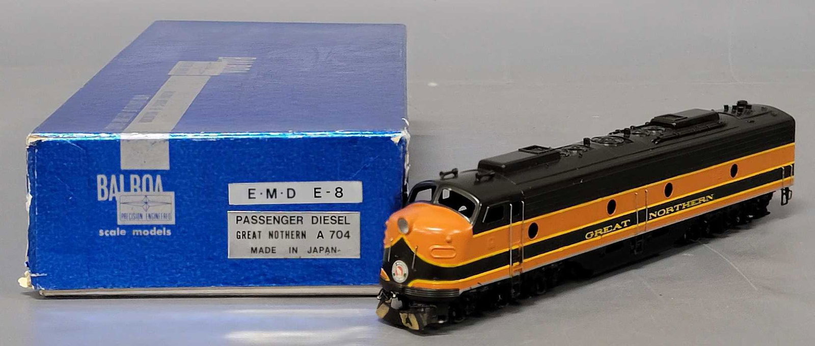 Balboa brass painted HO EMD E8 Great Northern diesel locomotive in original box: Balboa brass painted HO EMD E8 Great Northern diesel locomotive in original box, locomotive is good C5-6 only because the front bumper got smashed in at some point, paint has flaked there as well, it 