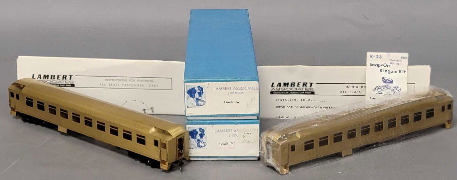 Two Lambert Associates brass HO Coach cars in original boxes: Two Lambert Associates brass HO Coach cars in original boxes, cars are near mint C8+ in an excellent original boxes.