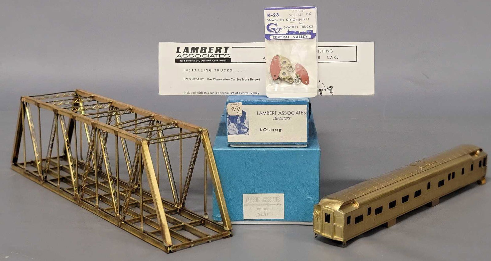 Two Lambert Associates brass HO pieces including a Truss Bridge and a Lounge car: Two Lambert Associates brass HO pieces including a Truss Bridge and a Lounge car, Lounge car is excellent to near mint C7-8, the Bridge is excellent as well, both come in excellent original boxes.