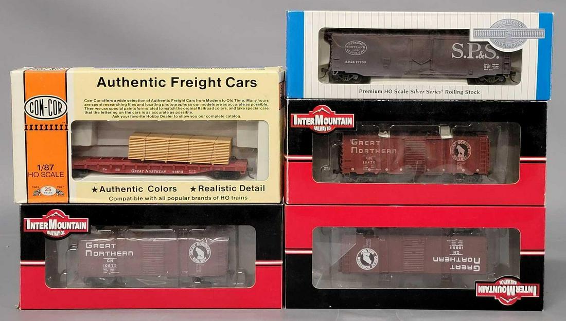 Five mixed maker HO Scale freight trains in original boxes: Five mixed maker HO Scale freight trains in original boxes, includes a ConCor Great Northern 54 foot flatcar with trailer, a Bachmann Silver series 18045 Spokane, Portland & Seattle plug door box 