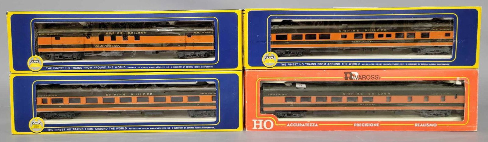 Four AHM Rivarossi HO passenger cars in original boxes: Four AHM Rivarossi HO passenger cars in original boxes, includes 6402 85 foot Observation, 6403 72 foot RPO car, 6404 85 foot Coach and 2892/0 dining car, all are very good plus, may have been lightly