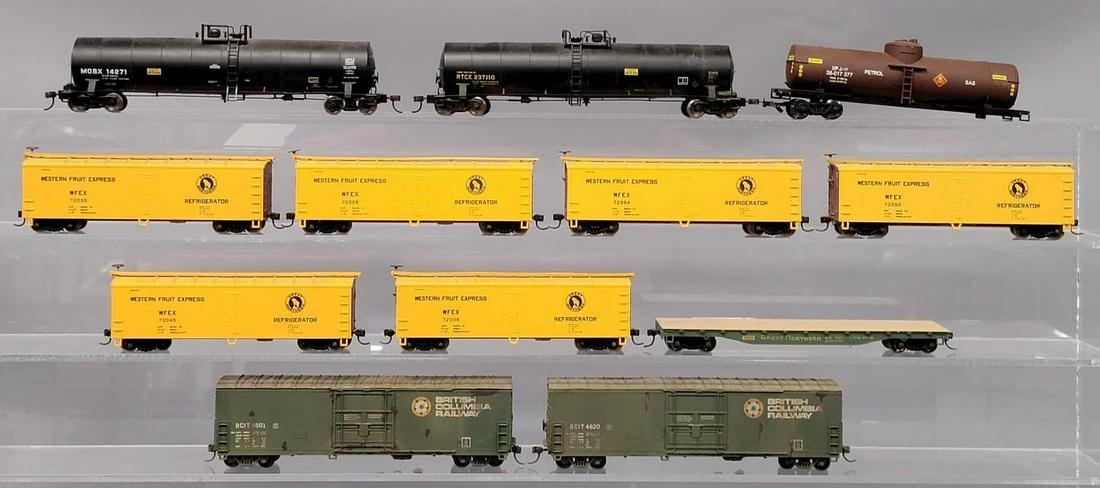 Collection of twelve HO weathered freight and tanker train cars: Collection of twelve HO weathered freight and tanker train cars, includes an RTCX tank car, an MOBX tank car, a single dome tank car marked Petrol, its missing one truck, easily replaced, six Great No