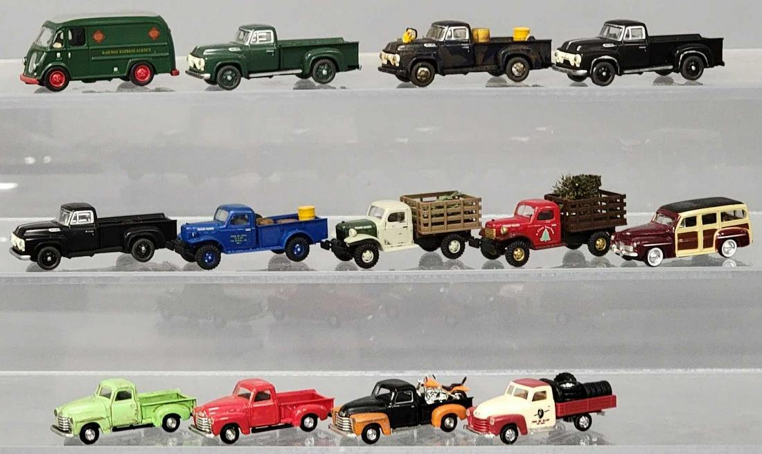 Thirteen mixed maker HO scale trucks including Busch and CMW: Thirteen mixed maker HO scale trucks including Busch and CMW, includes four Busch pickups, three Busch stake bed trucks, four CMW pickup trucks a CMW RAILWAY EXPRESS AGENCY van and a CMW Woody, most o
