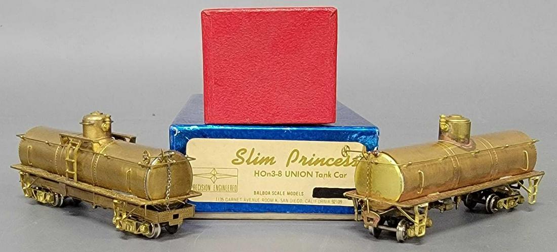 Two brass HOn3 UTLX Single Dome tank cars in original boxes: Two brass HOn3 UTLX Single Dome tank cars in original boxes, includes an unmarked one as in previous lots and the blue box is marked Precision Engineered Slim Princess HOn3-8 Union tank car, both are 