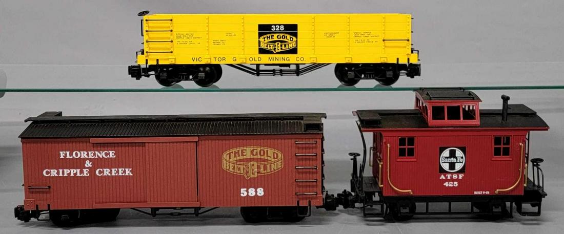 Three Bachmann Big Hauler G Scale train cars: Three Bachmann Big Hauler G Scale train cars, includes a yellow The Gold Belt Line gondola, a Florence & Cripple Creek wood sided box car and a Santa Fe caboose, all are very good to excellent C5-
