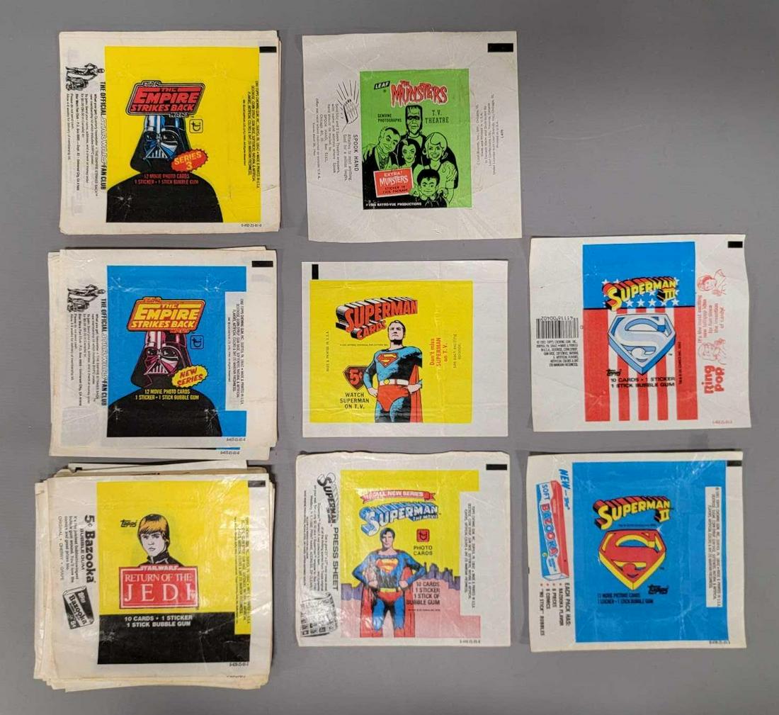 Collection of vintage trading card wax wrappers including 1964 Munsters and 1965 Superman (1 of 9)