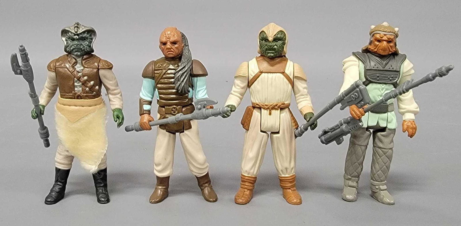 Four Return of the Jedi Skiff Guard action figures: Four Return of the Jedi Skiff Guard action figures, includes four different Skiff guard figures including Nikto, two different Klaatu and a Weequay, all have their original weapons, all are in very go