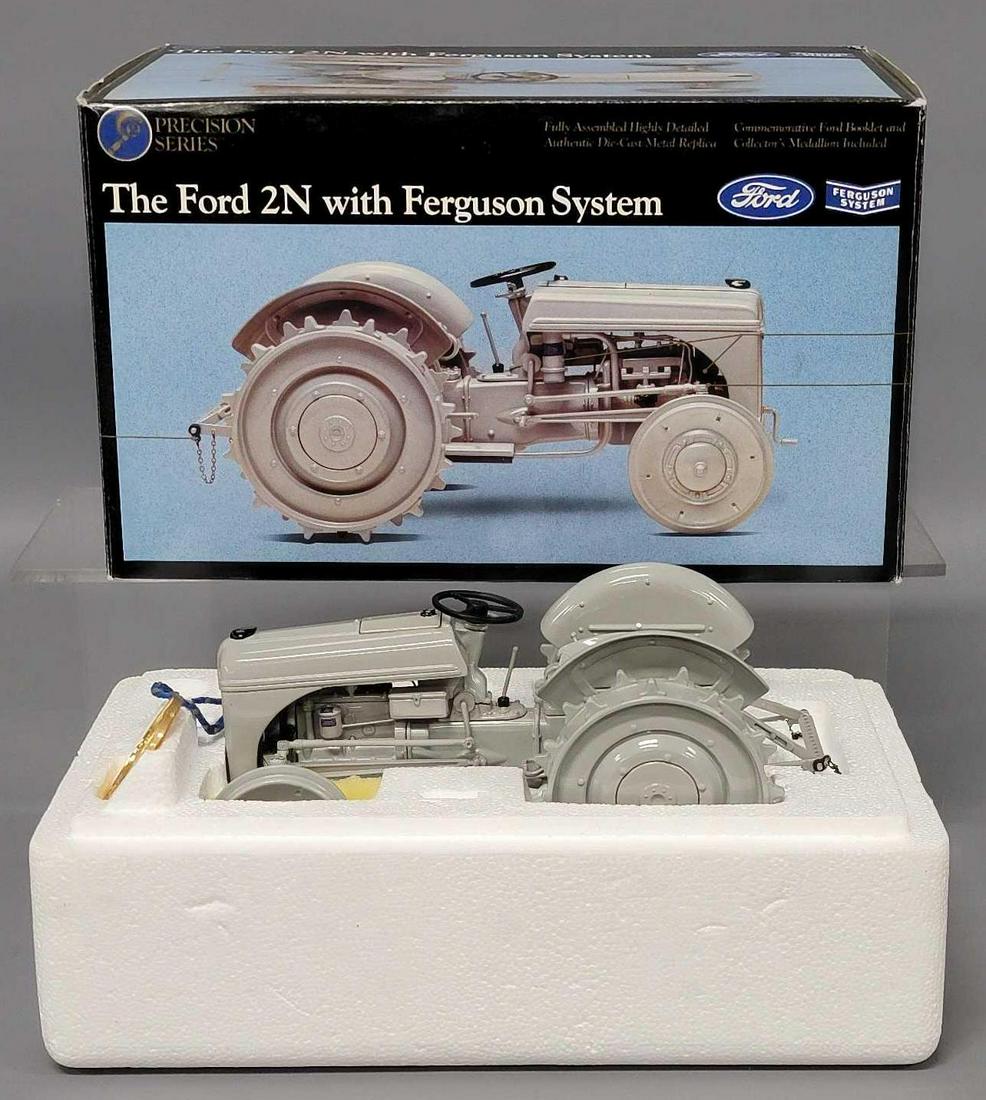 ERTL Precision Series Ford 1/16 scale 2N with Ferguson System new in original box: ERTL Precision Series Ford 2N with Ferguson System 1/16 scale new in original box, tractor is very clean, does not appear to have been displayed, box is very good with light shelf wear.