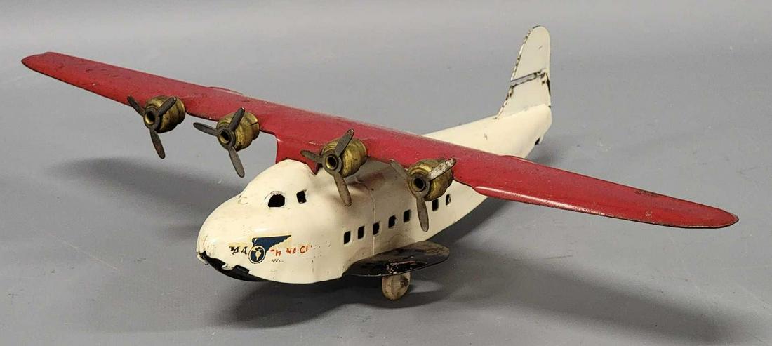 Wyandotte Vintage 1930's Pressed Steel China Clipper Airplane: Wyandotte Vintage 1930's Pressed Steel China Clipper Airplane, measures 9 inch long with a 13 inch wingspan, plane is all original with good decals that have a bit of wear to them, it is missing t