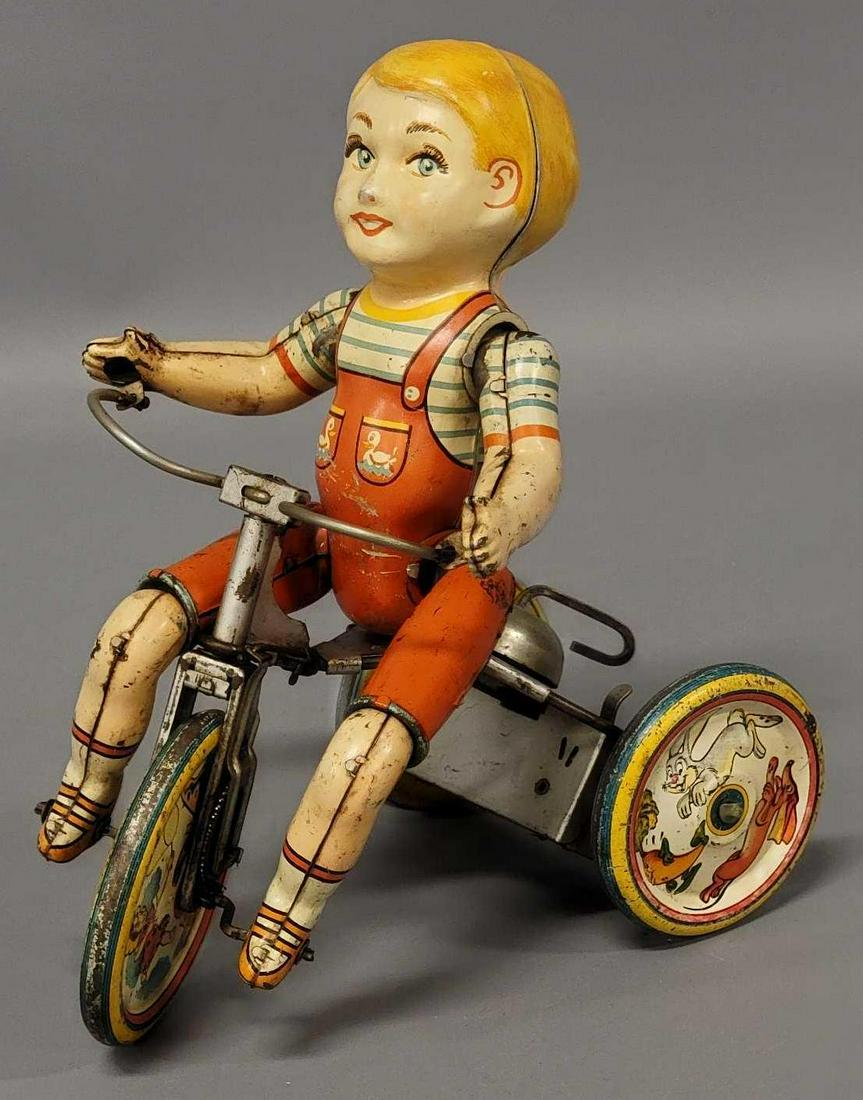 1930s Unique Art tin litho wind up cycle toy: 1930s Unique Art tin litho wind up cycle toy, toy has light to moderate play wear but overall nice color and displays well, it works as it should, as seen in the photos.
