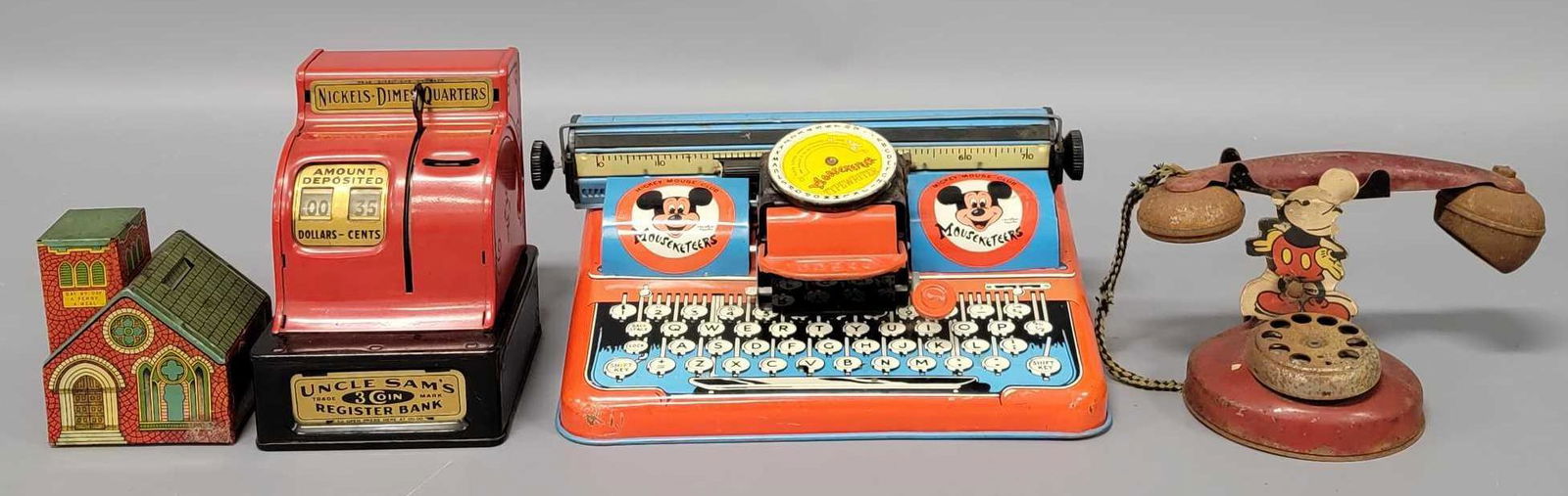 Two vintage Mickey Mouse tin toys a Chein Church bank and an Uncle Sams Register (1 of 6)