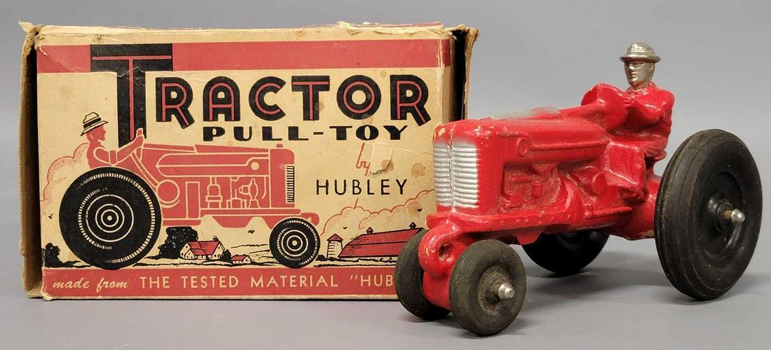 Hubley Tractor pull toy #125 in original box: Hubley Tractor pull toy #125 in original box, tractor is in excellent condition with some areas of minor paint loss, box states it is made of Huboid, box is complete and in very good condition for its