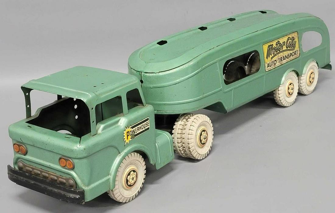 Marx pressed steel Powerhouse auto carrier: Marx pressed steel Powerhouse auto carrier, truck is in played with condition, missing its ramp and its windshield glass, as seen in the photos.