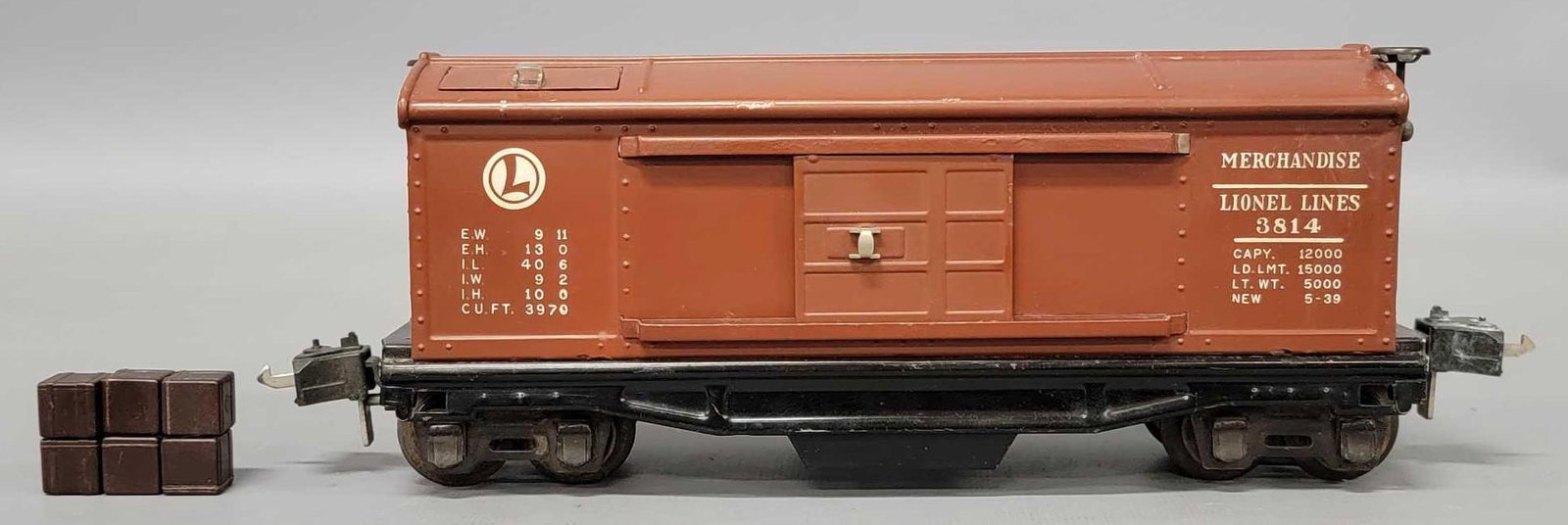 Lionel prewar O gauge 3814 operating merchandise car with cubes: Lionel prewar O gauge 3814 operating merchandise car with cubes. Car is what is commonly referred to has the rubber stamped variation although they were ALL heat stamped, , nice looking car, very clea