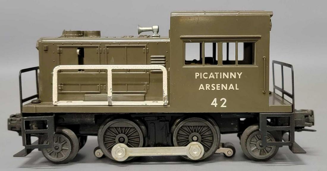 Lionel postwar O 42 Picatinny Arsenal gas turbine switcher: Lionel postwar O 42 Picatinny Arsenal gas turbine switcher. Unit shows light run time and has no screw cracks and perfect window struts but does have some minor scratches but is missing some paint fro