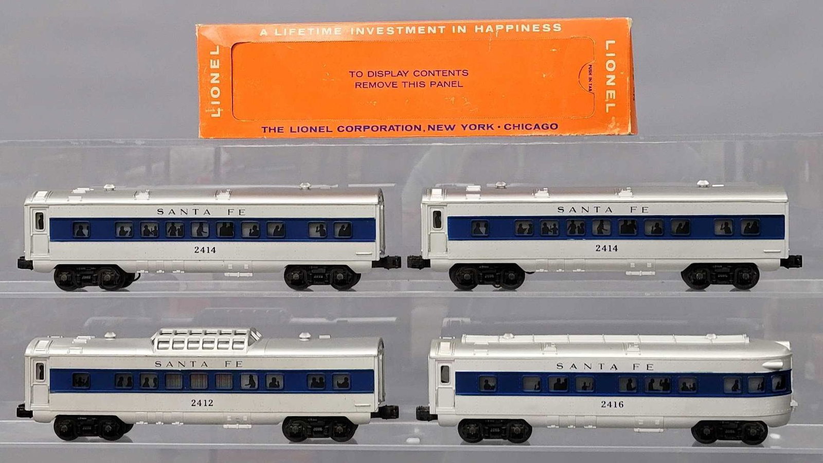 Lionel postwar O 2412 2414 2414 2416 blue stripe passenger cars with one OB: Lionel postwar O blue stripe passenger cars to include 2412 vista dome, two 2414 Pullman and 2416 observation cars, C7 with a very good 2416 original box with most perfs intact.