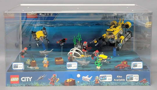 Lego City store display with factory built contents: Lego City store display with factory built contents. Measures 23.25 x 15 x 12 inches and has LED lights inside that are untested, it needs a power pack with a cord. The sets inside are stock numbers 6