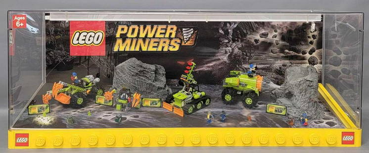 Lego Power Miners store display with factory built contents: Lego Power Miners store display with factory built contents. Measures 46.5 x 15.375 x 18 inches and has what appears to be a non-factory fluorescent light inside that came unplugged. The sets inside a