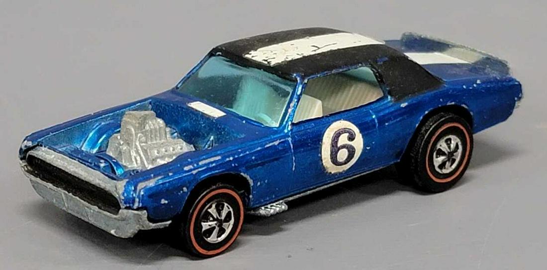Redline Hot Wheels blue TNT Bird: Redline Hot Wheels blue TNT Bird, a clean car with play wear as seen in the photos.