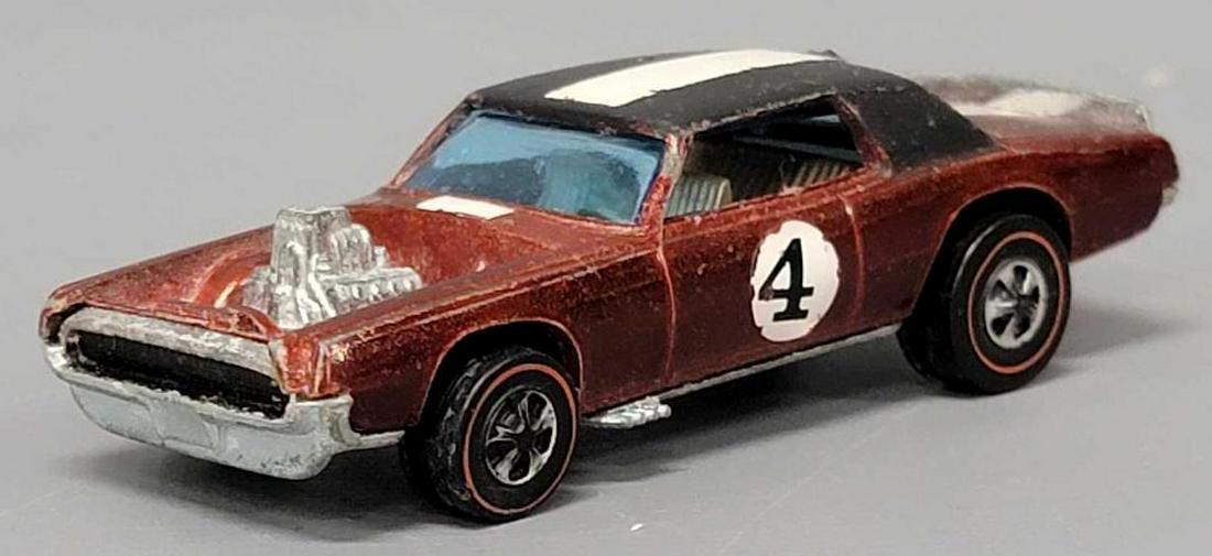 Redline Hot Wheels deep toned red TNT Bird with gray interior: Redline Hot Wheels deep toned red TNT Bird with gray interior, a clean car with play wear as seen in the photos.