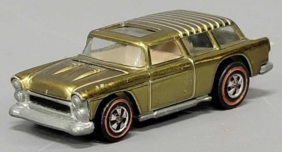 Redline Hot Wheels yellow classic Nomad: Redline Hot Wheels yellow classic Nomad, very nice and clean car with a few tiny chips and some toning on the passengers side door with a mostly shiny base as seen in the photos.