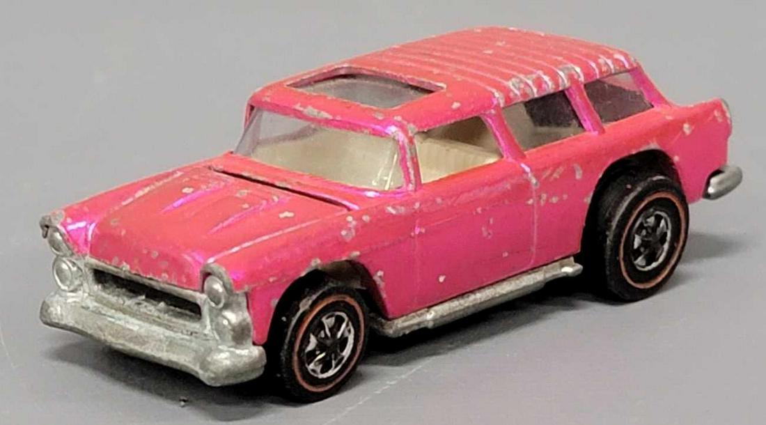 Redline Hot Wheels hot pink classic Nomad: Redline Hot Wheels hot pink classic Nomad, a clean car with no toning but has many paint chips with a dull base and missing a lot of the wheel chrome as seen in the photos.