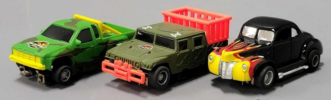 Two Jurassic Park Lost World Tyco slot cars and a '40 Ford with flames (1 of 7)
