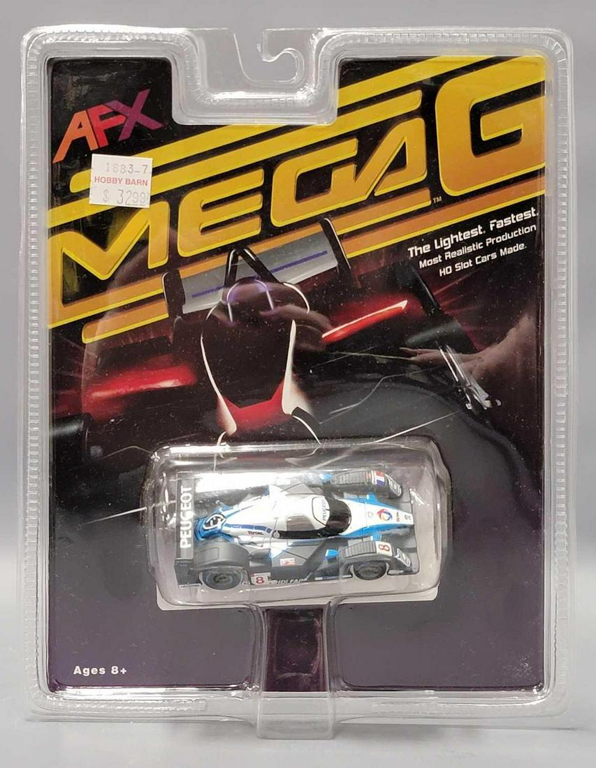 Tomy AFX Mega-G Low Estimate Mans #8 Peugeot 908 HO slot car MOC: Tomy AFX Mega-G Low Estimate Mans #8 Peugeot 908 HO slot car mint on a sealed blister card, the car is mint on a nice sealed card as seen in the photos.