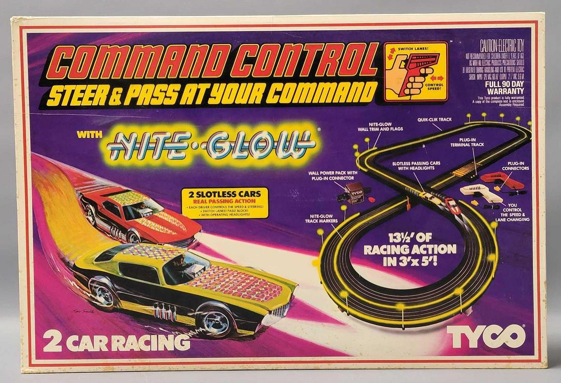 Tyco Command Control Nite Glow slot car set in original box incomplete: Tyco Command Control Nite Glow slot car set in original box. Set is missing all of the straight track but does come with fourteen sections of curved 9 inch track, 16 pieces of wall trim, four small, f