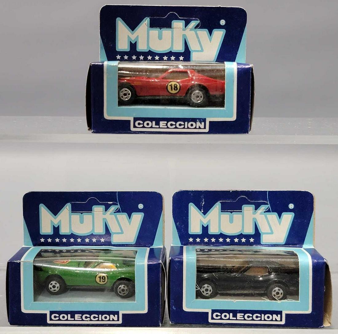 Three different Muky Corvette 1/64 die cast cars in original boxes: Three different Muky Corvette 1/64 die cast cars in original boxes, includes black, red and green, all near mint to mint in very good to excellent original boxes as seen in the photos.