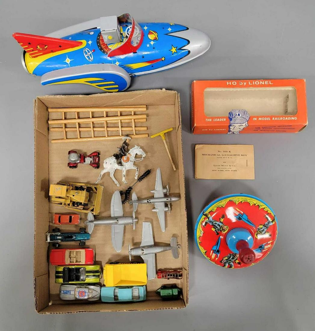 Box of mixed toys and die cast cars: Box of mixed toys and die cast cars to include a tin space motif top, modern space patrol, some modern era Hot Wheels, a few plastic airplanes and an empty Lionel HO 0845 empty original box with origi