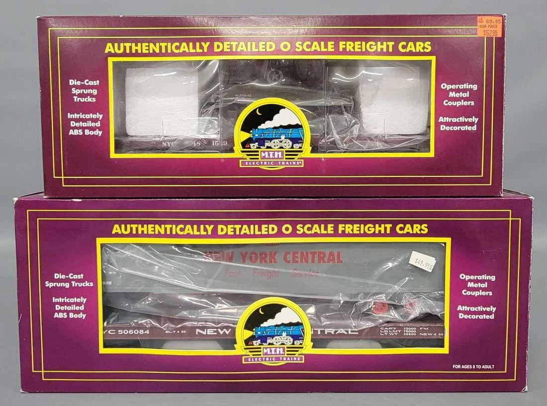 Two MTH Premier New York Central flat cars in original boxes: Two MTH Premier New York Central flat cars in original boxes to include 41 foot wood with Sherman tank and flat car with 48 foot trailer, C8 in excellent original boxes.