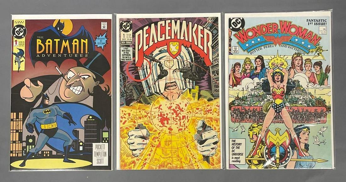 3 mixed DC #1 comic books: Batman Adventures 1, Peacemaker 1, Wonder Woman 1 are all high grade as seen in the photos.