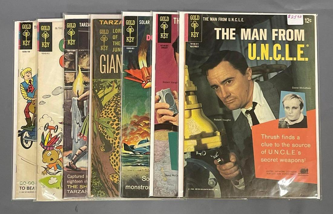 7 mixed Gold Key books: Man From UNCLE 3 and 4 both have small tear on back cover. Doctor Solar 24 is low grade, Tarzan Lord of the Jungle 1 6.0 Fine, Tarzan of the Apes 175 low grade with writing on cover, Choo Choo Charlie