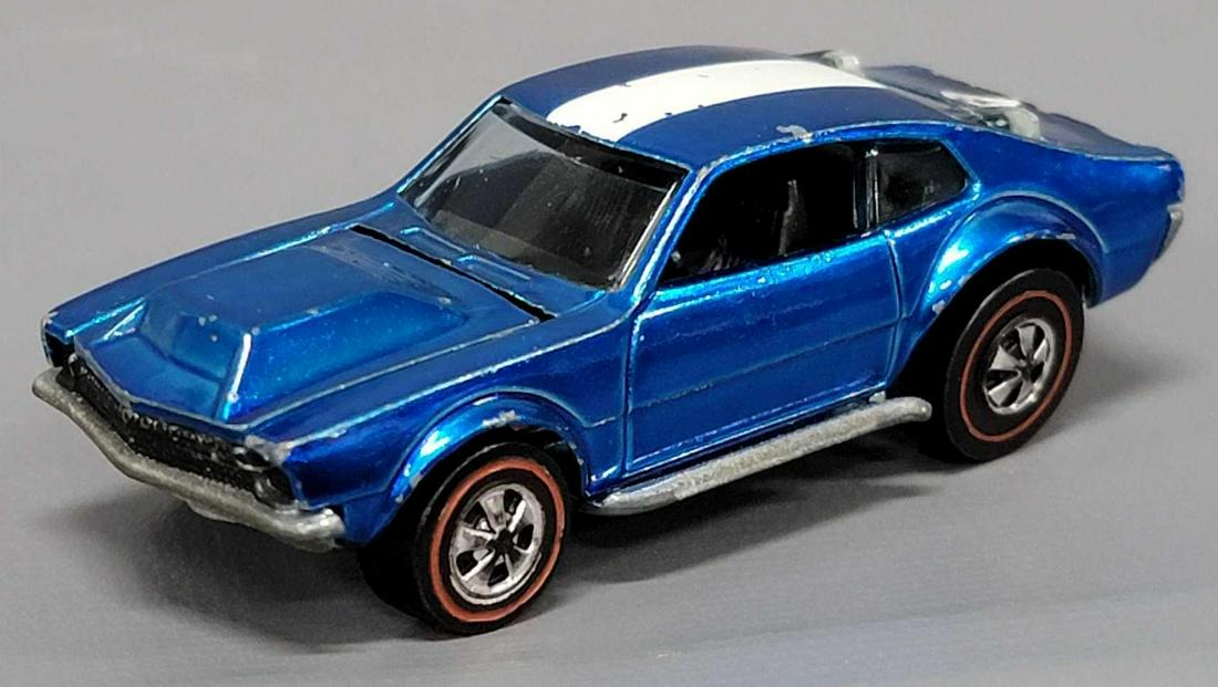 Redline Hot Wheels blue Mighty Maverick: Redline Hot Wheels blue Mighty Maverick, missing wing and has some wear as seen in the photos.