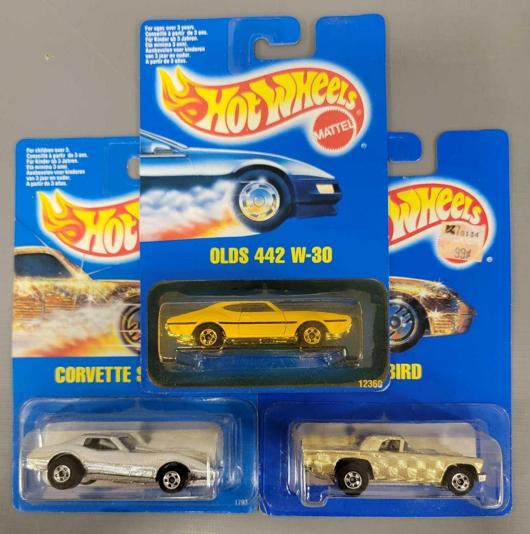 Three Hot Wheels International Cards: Three Hot Wheels International Cards. Oldsmobile 442, 57 TBird, and Corvette Stingray all mint on blister card and cards are near mint