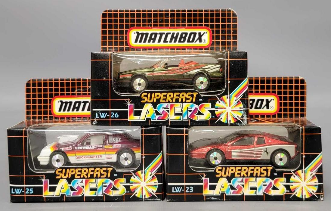 Three Matchbox Superfast Lazers: Matchbox Superfast Lazers Buick Le Sabre, Ferrari, and a Cadillac Allante box is near mint, mint on blister card