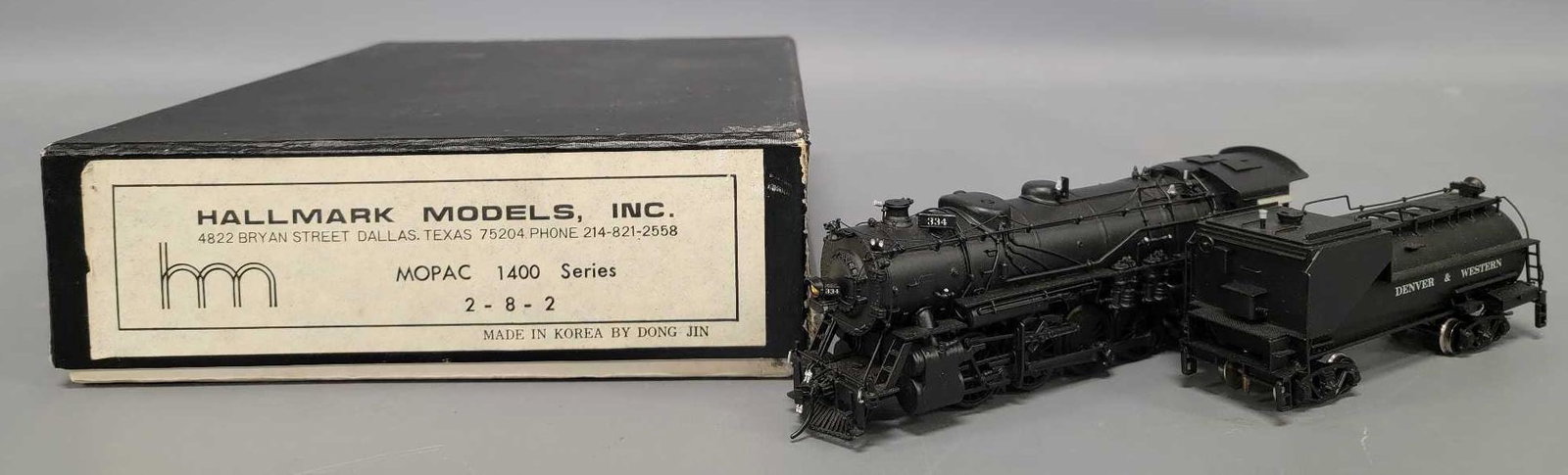 Hallmark HO scale brass MOPAC 1400 series 2-8-2 steam locomotive in original box: Hallmark HO scale brass MOPAC 1400 series 2-8-2 steam locomotive in original box, custom painted in Denver and Western livery, C7+ with very light run time in a good original box.