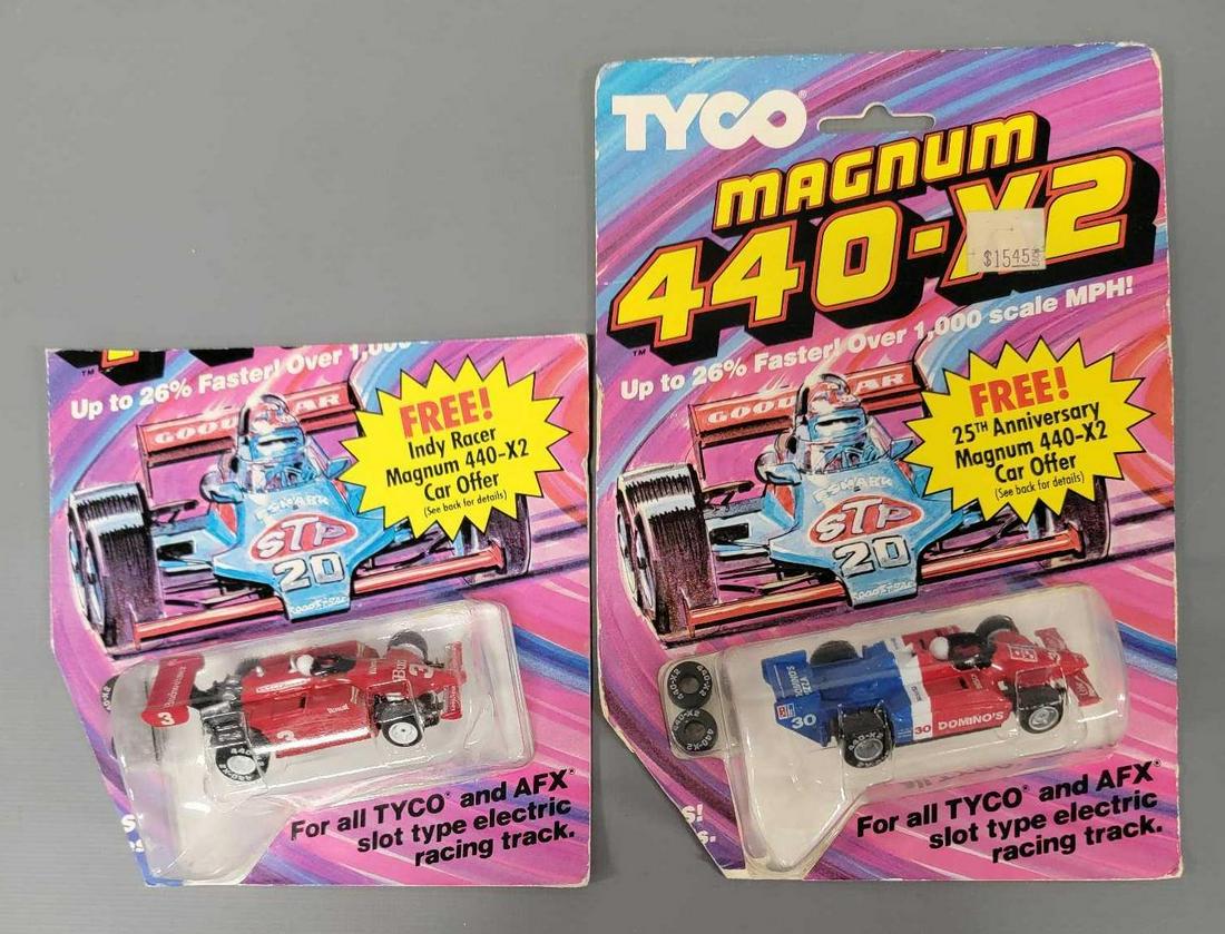 Two mint Tyco Magnum 440 X-2 Indy racer cars on cut blister cards (1 of 6)