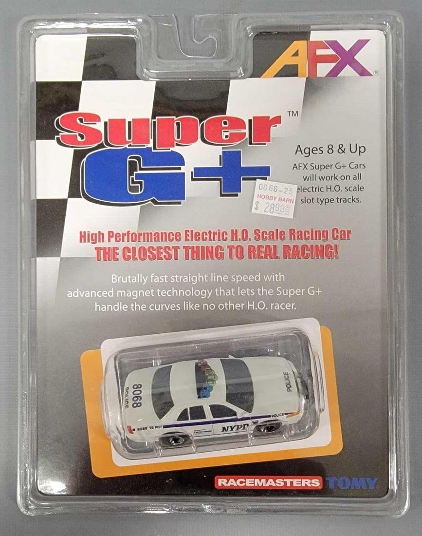 Tomy AFX Super G+ NY City Police HO slot car mint on a sealed blister card: Tomy AFX Super G+ NY City Police HO slot car mint on a sealed blister card as seen in the photos.
