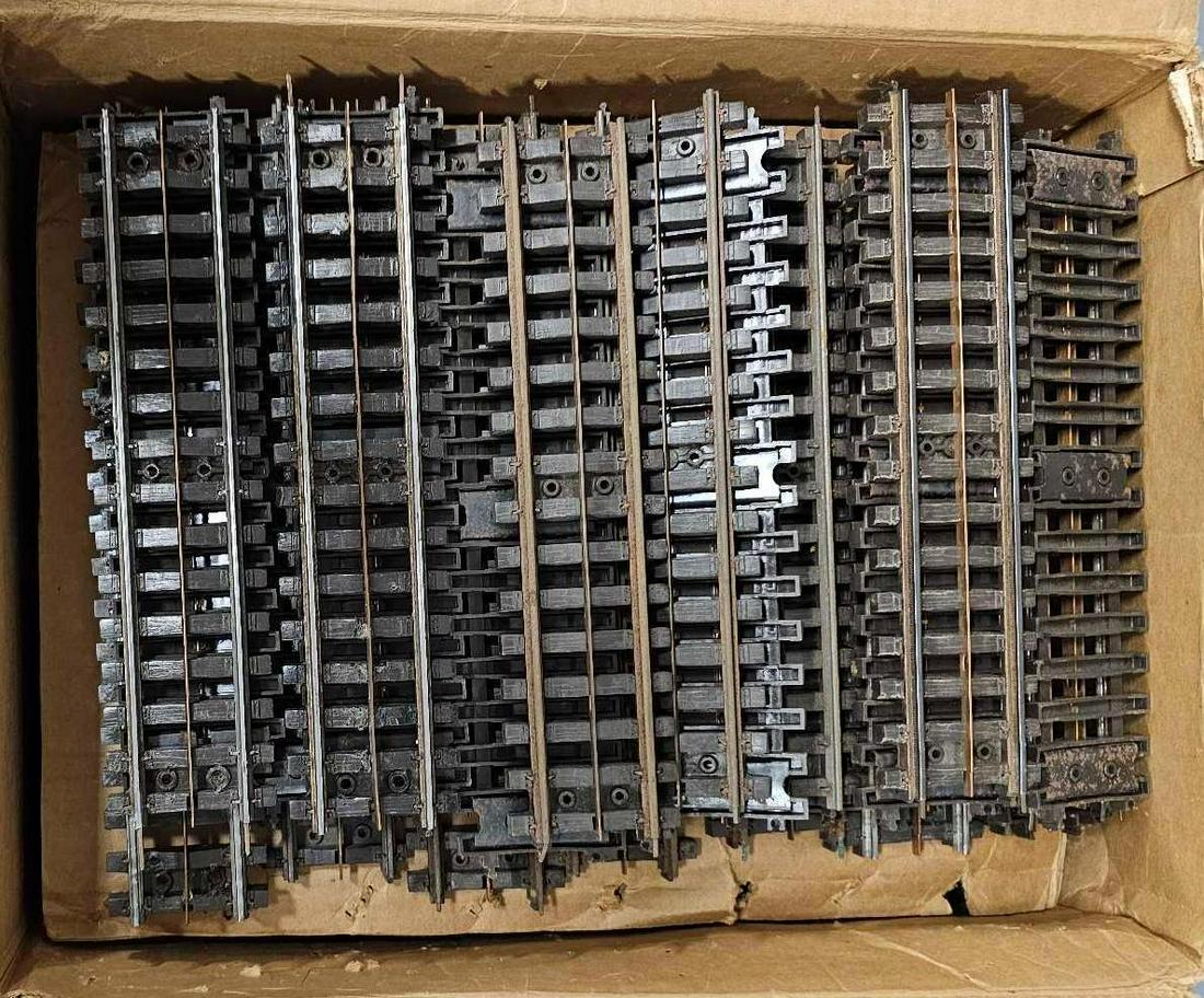 Three boxes of Lionel postwar Super O straight and curved track sections: Three boxes of Lionel postwar Super O straight and curved track sections, some clean, some dirty, some in between. Sold as-is as seen in the photos with no returns.