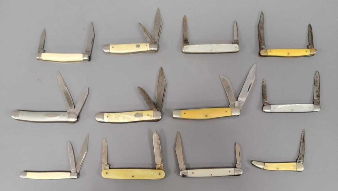 Group of twelve smaller old pocket knives: Group of twelve smaller old pocket knives ranging from 2 1/2 inches to 3 1/4 inches long when closed as seen in the photos.