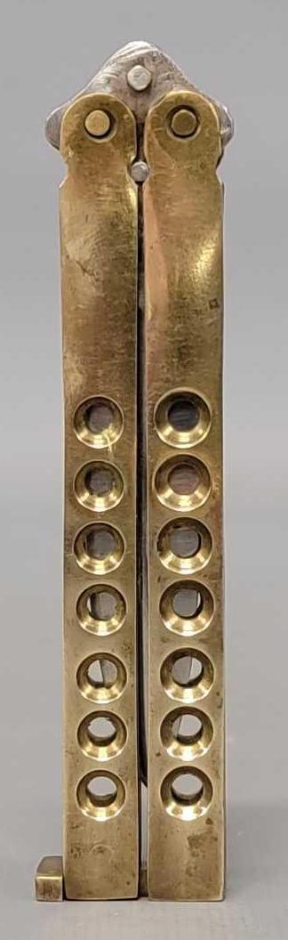 1980's stainless Pakistan butterfly knife: 1980's stainless Pakistan butterfly knife, measures 7 1/4 inches open and 4 1/4 inches when closed as seen in the photos.