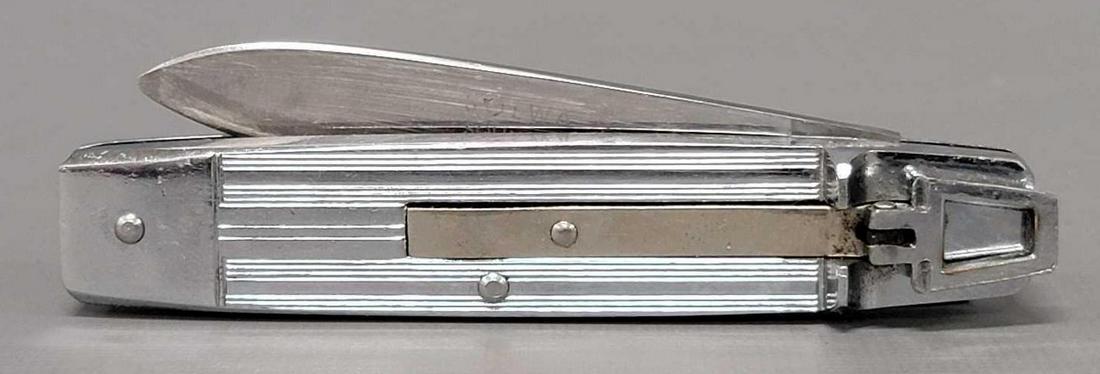 Solwa Solingengen Rostfrei switchblade knife: Solwa Solingengen Rostfrei switchblade knife, made in Germany. Nice shape but the blade does not close all of the way although I have seen others that look exactly the same. Measures 4 1/16 closed and