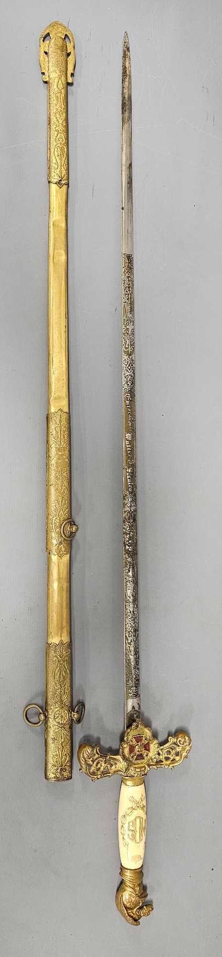 Masonic Knights Templar Commander ceremonial sword in scabbard: Masonic Knights Templar Commander ceremonial sword in scabbard, marked the Pettibone Bros Mfg Co Cincinnati, O. measures 39 inches long in scabbard, nicely decorated blade that is personalized to Emin